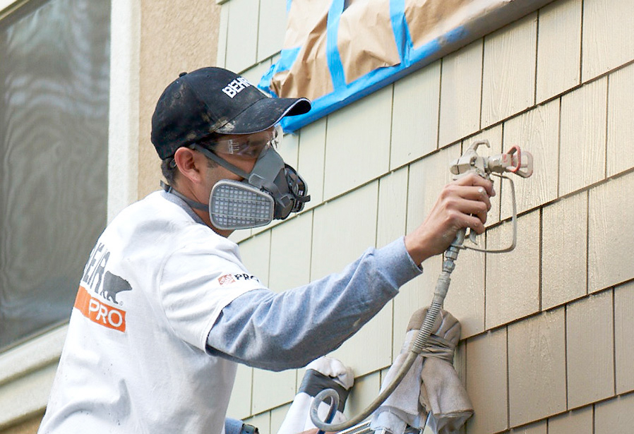 Pro Contractor wearing a cap and shirt with Behr